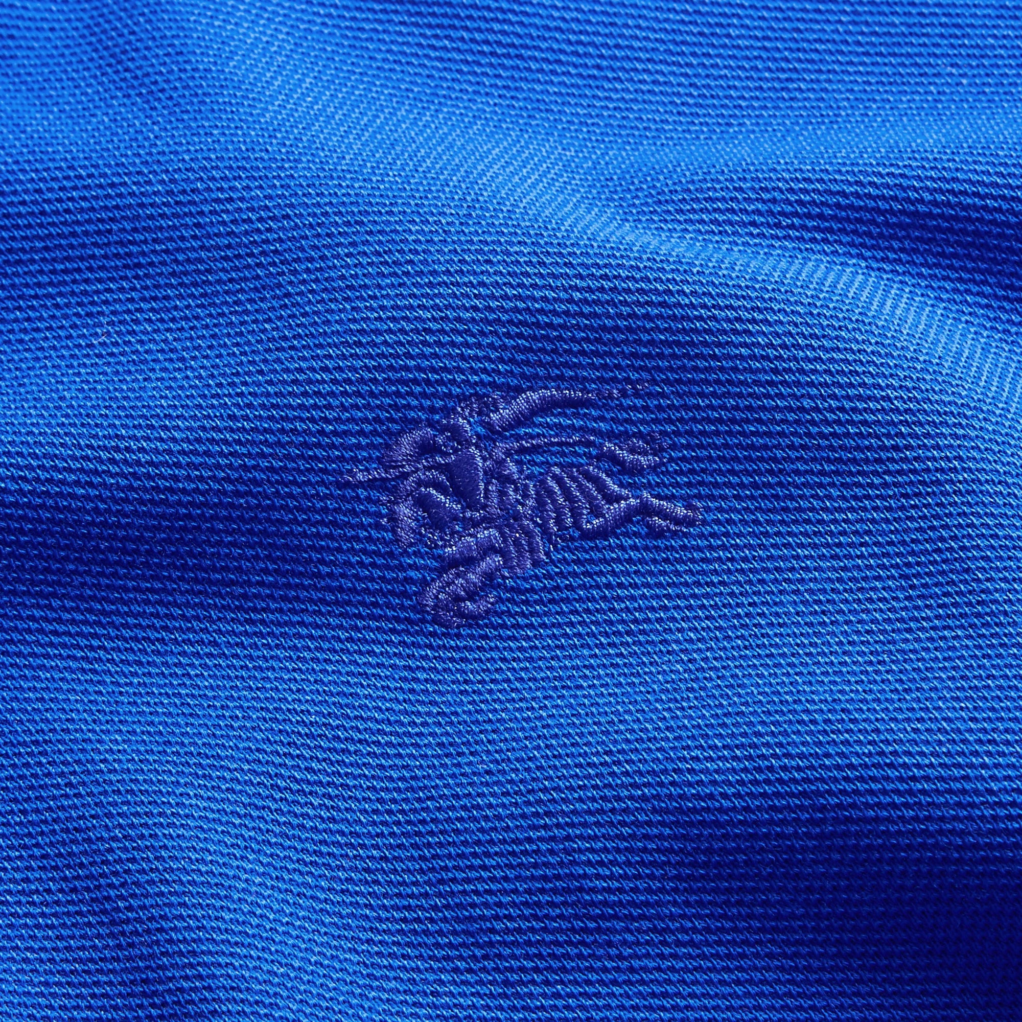 Polo à manches longues avec patte à motif check - Brilliant Blue